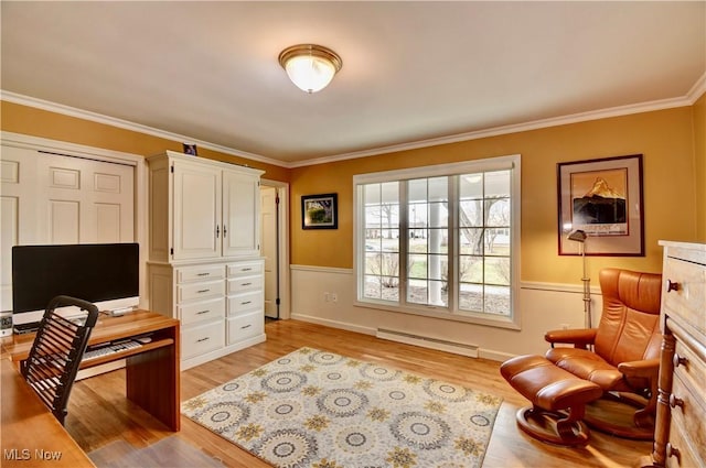 office space with light wood finished floors, baseboard heating, wainscoting, and crown molding