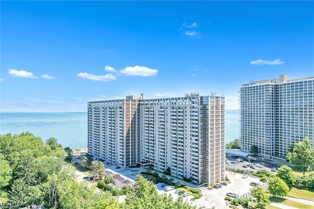 view of building exterior with a view of city and a water view