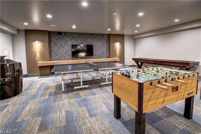 game room featuring recessed lighting, carpet flooring, and an accent wall