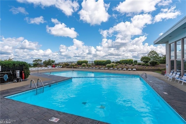 community pool featuring a patio area