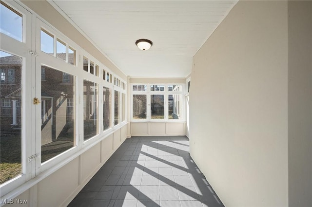 unfurnished sunroom with plenty of natural light