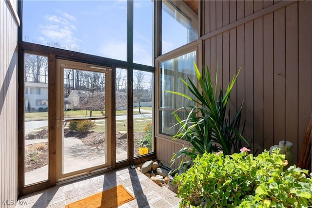 unfurnished sunroom featuring a wealth of natural light