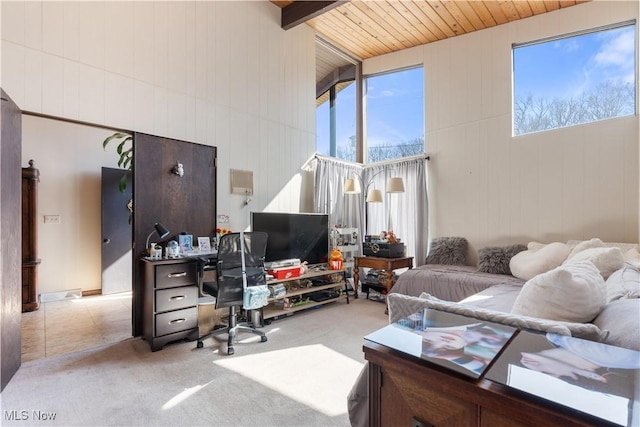 carpeted living area featuring beamed ceiling, wooden ceiling, and tile patterned flooring