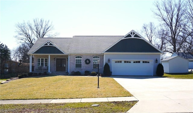 view of front of home with a front lawn, concrete driveway, brick siding, and an attached garage