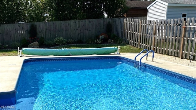 view of pool with a fenced backyard and a fenced in pool