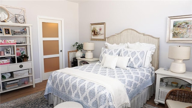 bedroom with wood finished floors