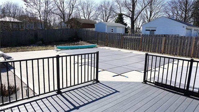 wooden terrace with a patio area and a fenced backyard