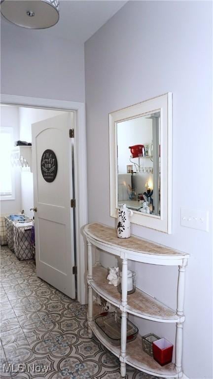 hallway with light tile patterned floors