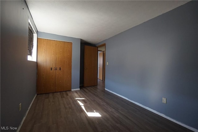 4286 W 152nd St, Cleveland, OH 44135 - unfurnished bedroom featuring wood finished floors, a closet, and baseboards