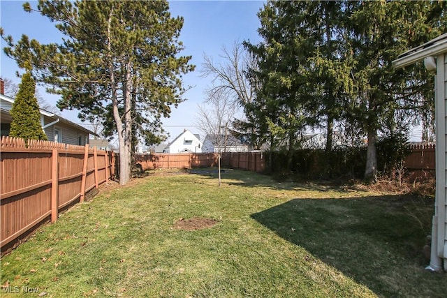 view of yard featuring a fenced backyard