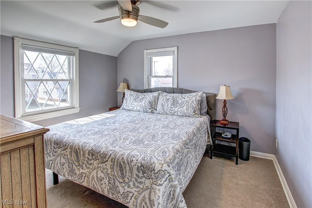 bedroom with a ceiling fan, lofted ceiling, carpet, and baseboards