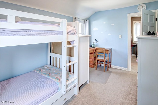 bedroom with baseboards, carpet, and vaulted ceiling