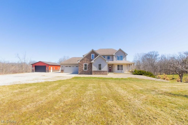 view of front facade featuring stone siding, driveway, an attached garage, and a front lawn