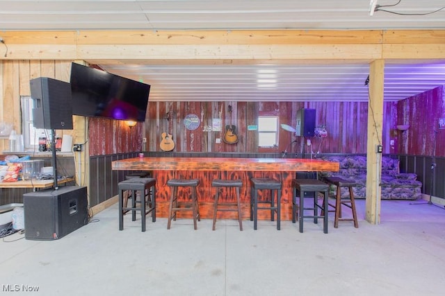 6603 Congress Rd, Spencer, OH 44275 - indoor dry bar featuring finished concrete flooring and wood walls