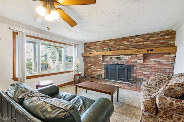 carpeted living area featuring a ceiling fan, a textured ceiling, crown molding, baseboards, and a brick fireplace