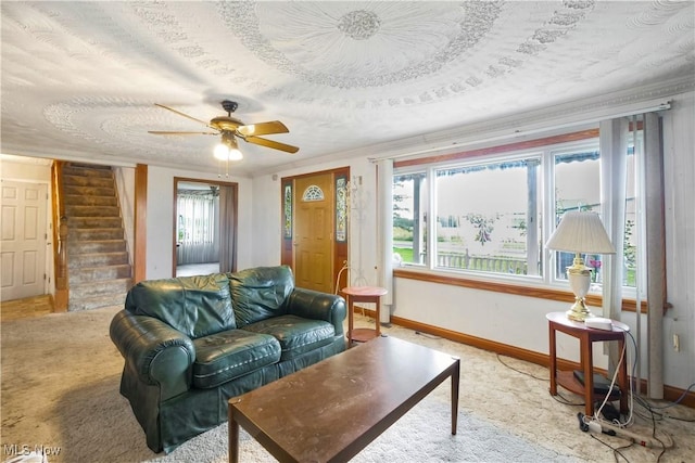 carpeted living room with a wealth of natural light and a textured ceiling