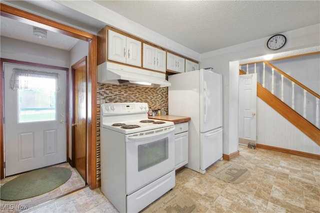 kitchen with tasteful backsplash, under cabinet range hood, light countertops, white appliances, and a textured ceiling