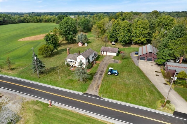 drone / aerial view featuring a forest view