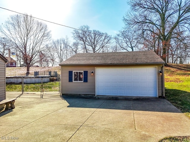 detached garage with fence