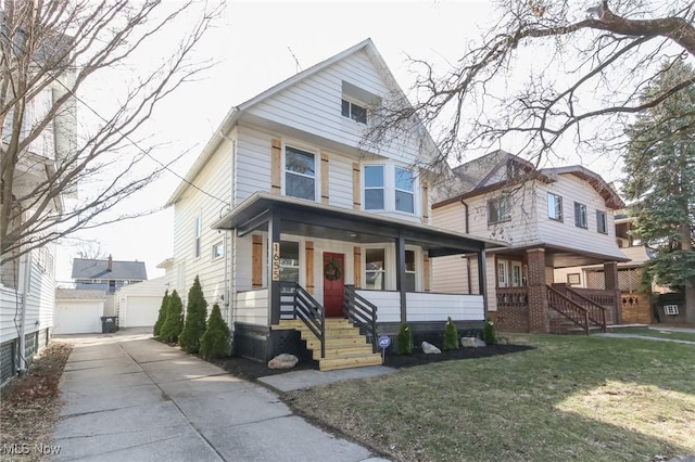 traditional style home with covered porch, an outdoor structure, and a front yard