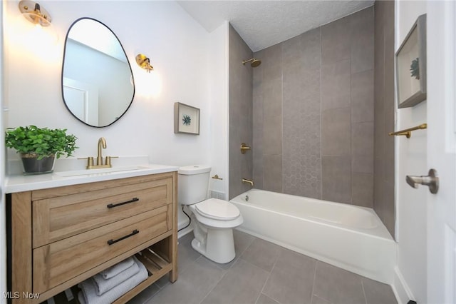 full bath with tile patterned flooring, toilet, vanity, bathtub / shower combination, and a textured ceiling