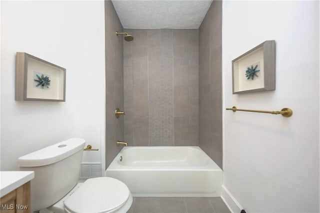 full bath with toilet, vanity, bathing tub / shower combination, tile patterned floors, and a textured ceiling