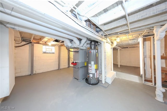 below grade area featuring heating unit and water heater