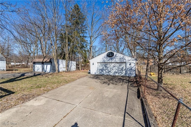 exterior space with an outdoor structure and fence