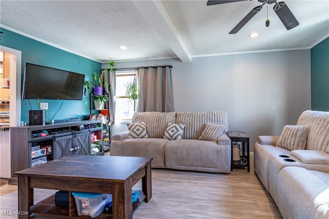 living area featuring crown molding, beam ceiling, recessed lighting, light wood-style flooring, and a ceiling fan