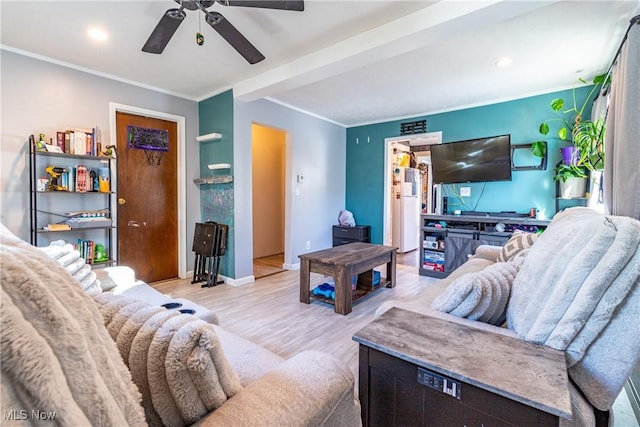 living room with a ceiling fan, baseboards, recessed lighting, ornamental molding, and light wood-type flooring