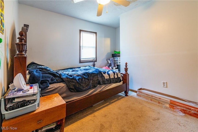 carpeted bedroom with a ceiling fan