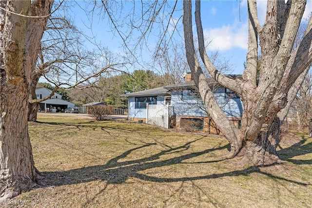 view of front of property with a front lawn and a chimney