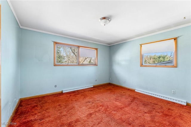 carpeted spare room with a baseboard heating unit, baseboards, and ornamental molding