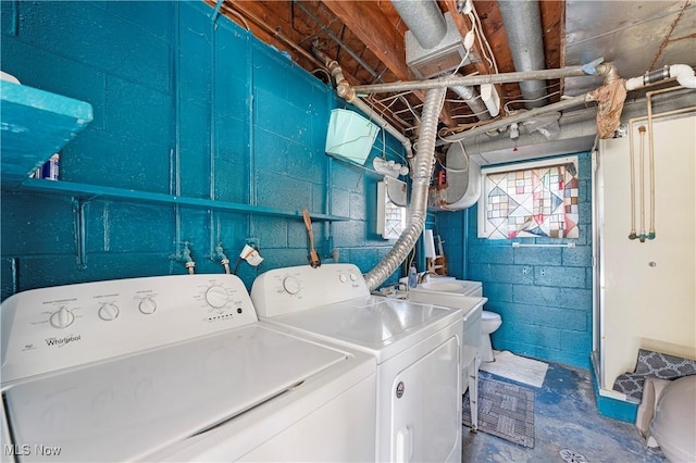 clothes washing area with washer and dryer and laundry area