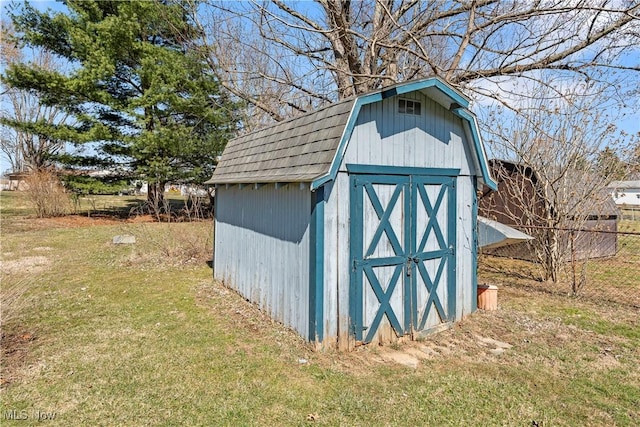 view of shed with fence