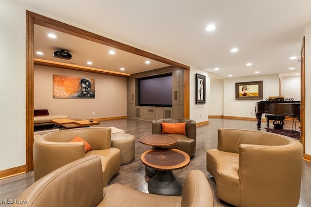 cinema room with recessed lighting and baseboards