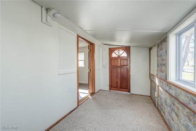 foyer featuring baseboards