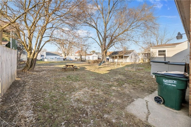 view of yard featuring a residential view and fence