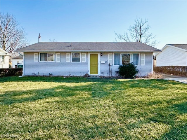 ranch-style house featuring a front lawn