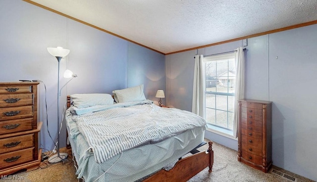 bedroom featuring ornamental molding, multiple windows, carpet, and a textured ceiling