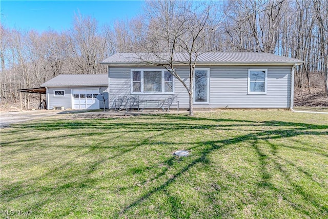 view of front of home featuring a front yard and metal roof