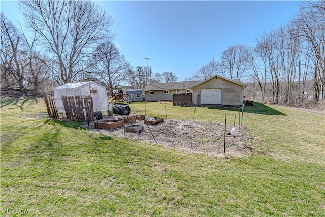 view of yard with an outdoor structure and a garage