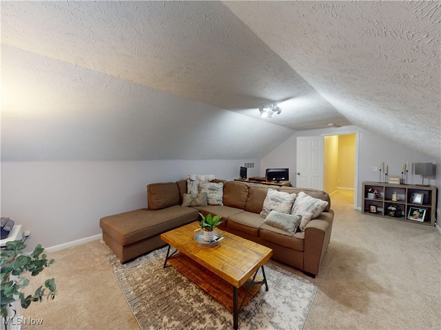 living area with baseboards, light colored carpet, vaulted ceiling, and a textured ceiling