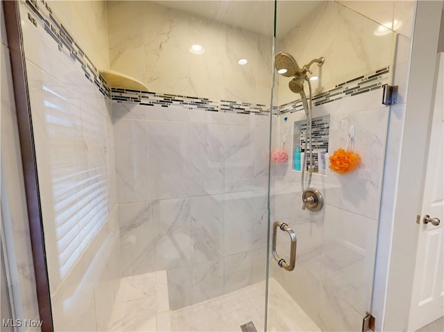 full bath featuring a shower stall