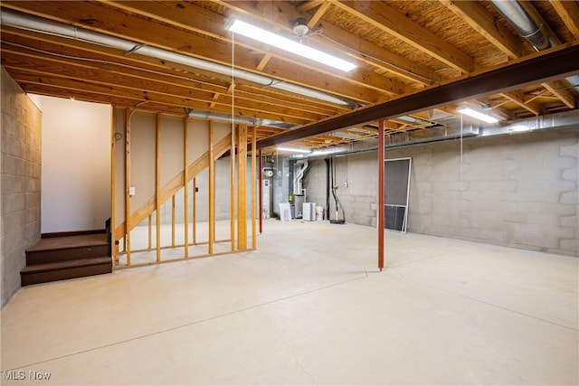 unfinished below grade area with stairway and water heater