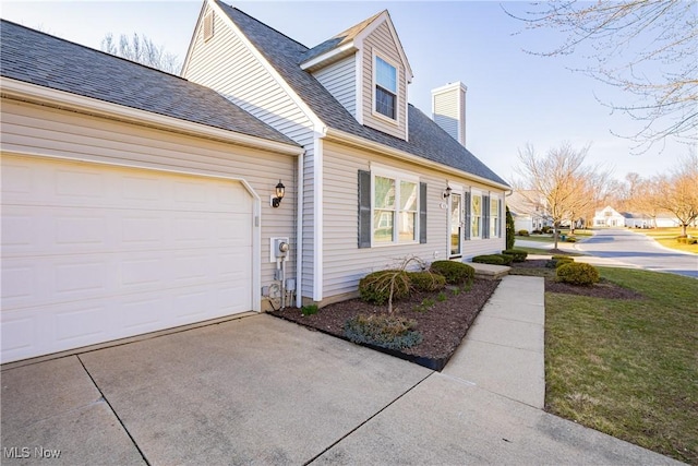 view of home's exterior with roof with shingles, a chimney, concrete driveway, and an attached garage