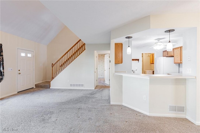 interior space featuring stairs, visible vents, and carpet flooring