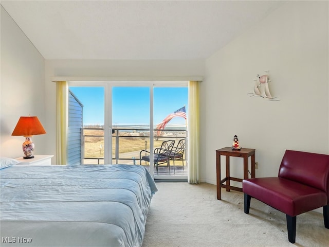 bedroom with carpet, access to exterior, and vaulted ceiling