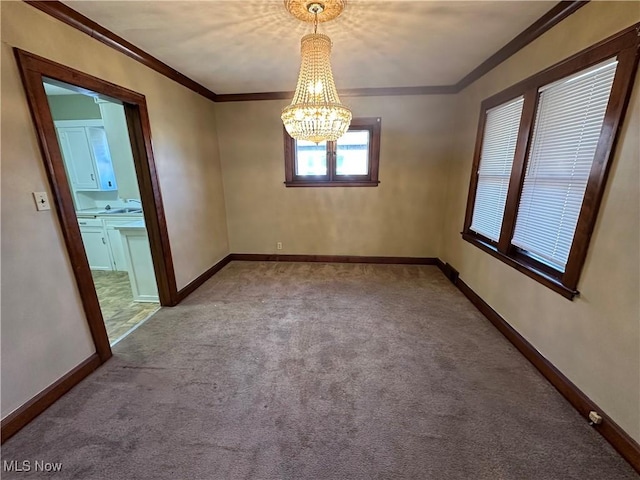 unfurnished room with crown molding, a notable chandelier, light colored carpet, and baseboards