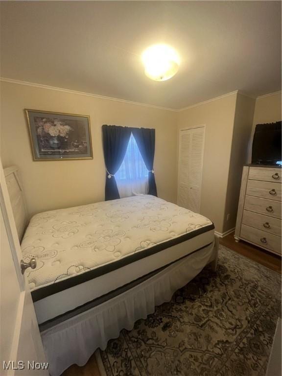 bedroom with ornamental molding